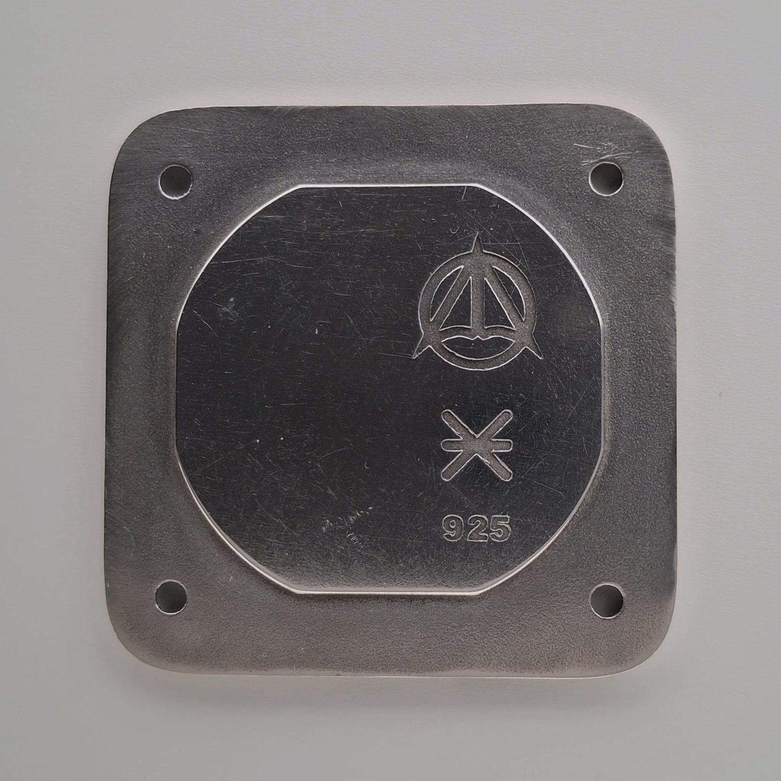The inside of the caseback, with the 925 sterling silver stamp